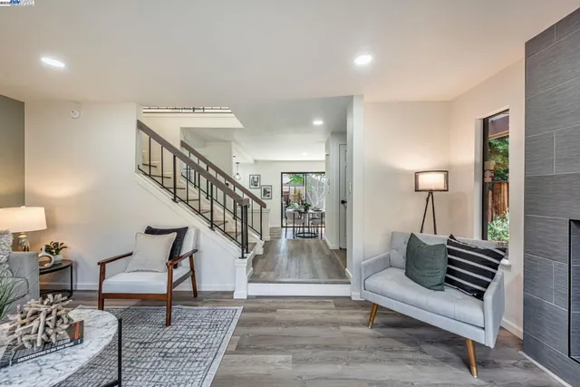 a living room with furniture and a rug