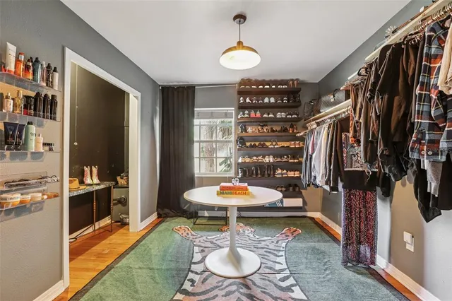 a living room with lots of furniture and a chandelier
