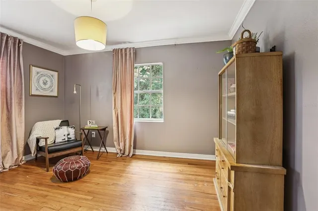 a view of a livingroom with furniture and wooden floor