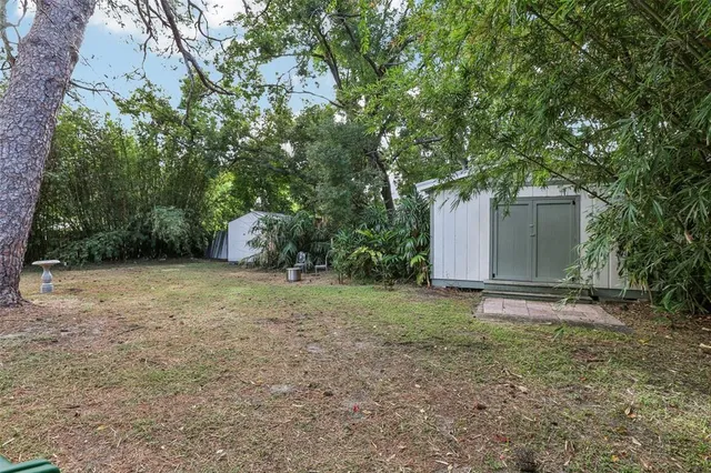 a backyard of a house with lots of green space