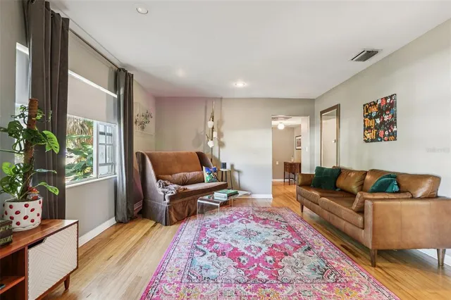 a living room with furniture and a rug