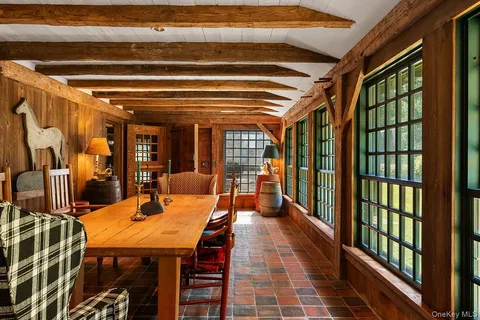 a dining room with a table and chairs