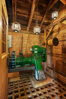 a view of a porch with a table and chairs