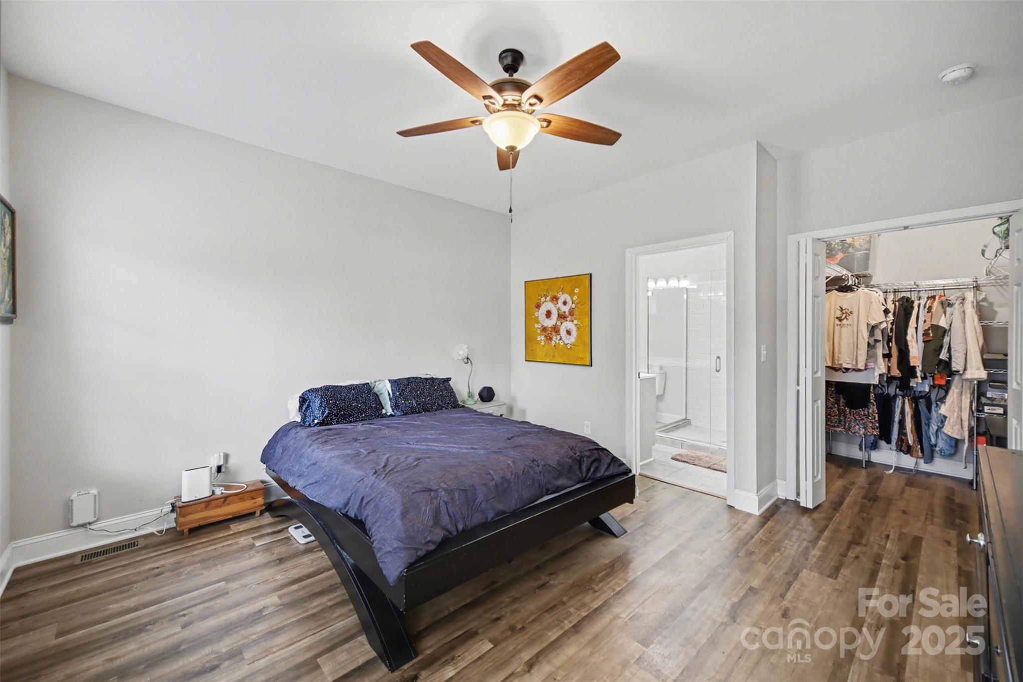 802 Lowder Street Albemarle, NC 28001 - Photo 12 of 22 a bedroom with a bed and a ceiling fan