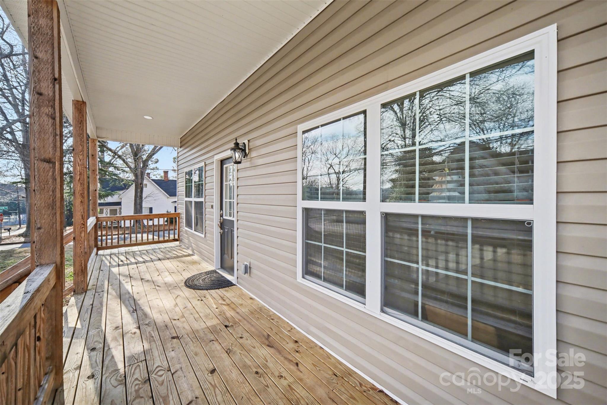 802 Lowder Street Albemarle, NC 28001 - Photo 3 of 22 a view of a balcony with wooden floor