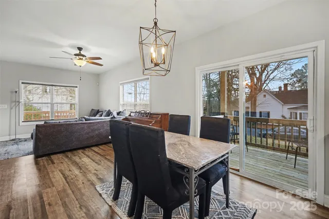 a living room with furniture a wooden floor and a window