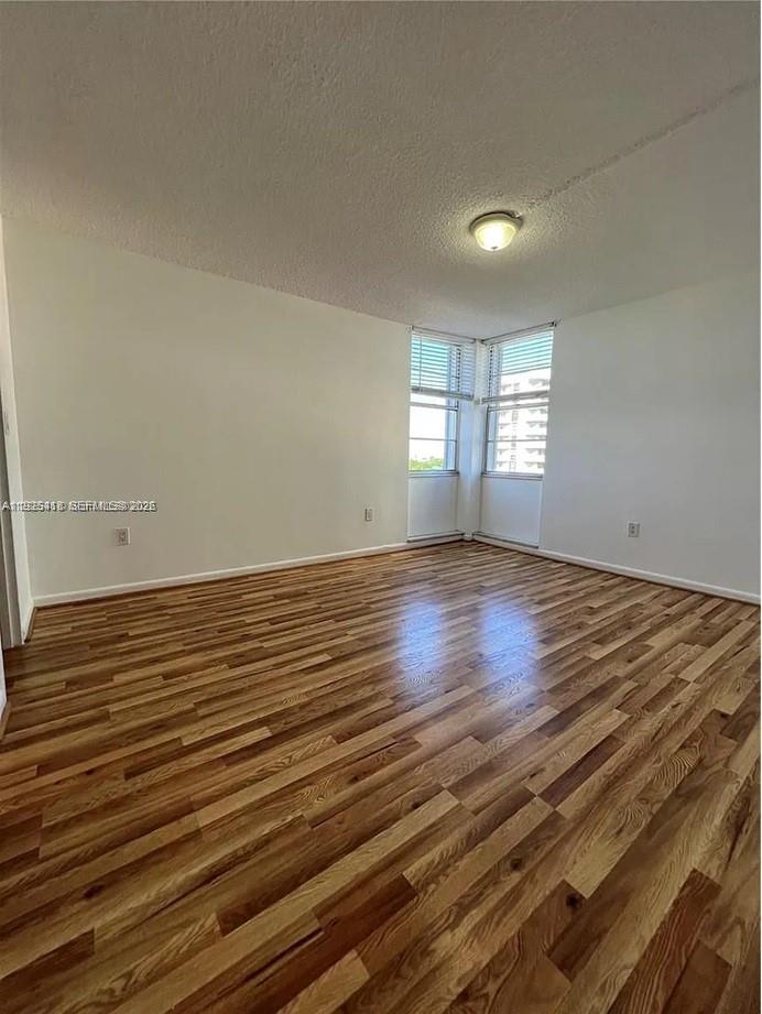 145 Southeast 25th Road, Unit 801 Miami, FL 33129 - Photo 7 of 12 wooden floor in an empty room