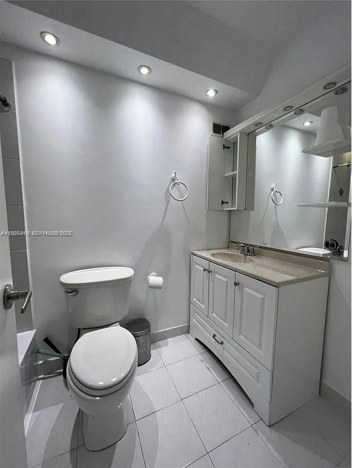 145 Southeast 25th Road, Unit 801 Miami, FL 33129 - Photo 9 of 12 a bathroom with a toilet sink and mirror