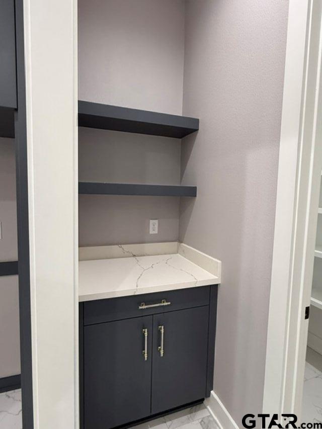 9065 Long Branch Tyler, TX 75703 - Photo 12 of 25 a kitchen with a sink and a refrigerator
