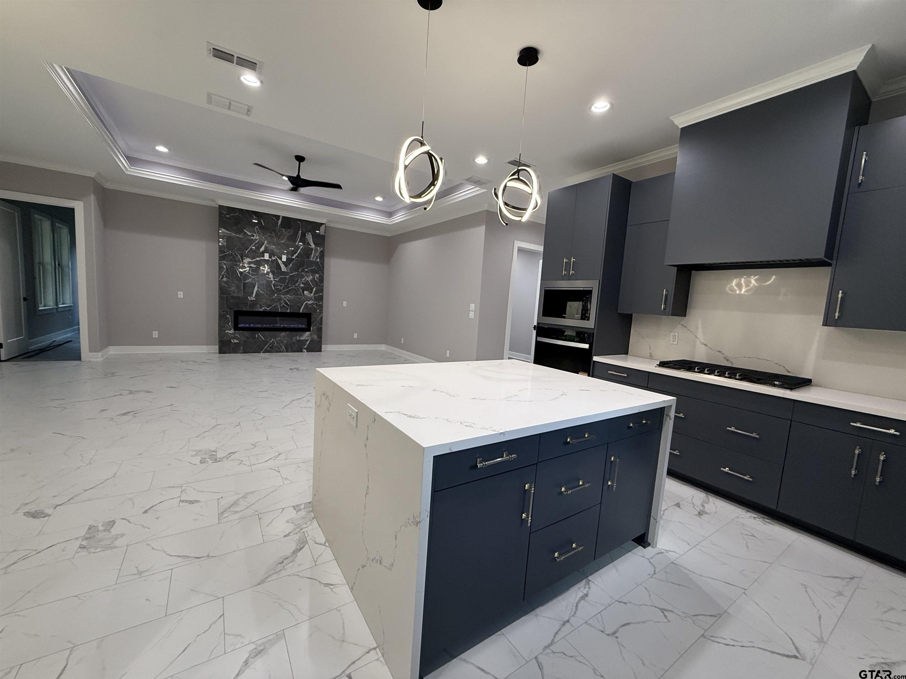 9065 Long Branch Tyler, TX 75703 - Photo 7 of 25 a kitchen with cabinets and window