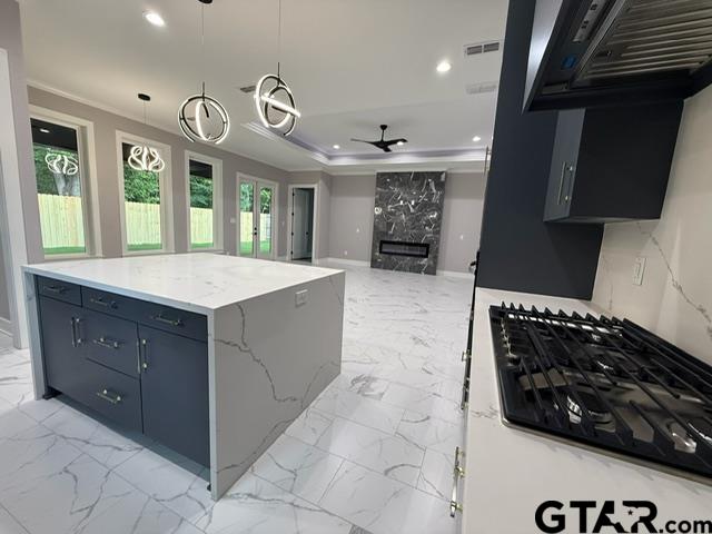 9065 Long Branch Tyler, TX 75703 - Photo 8 of 25 a kitchen with a stove and a sink