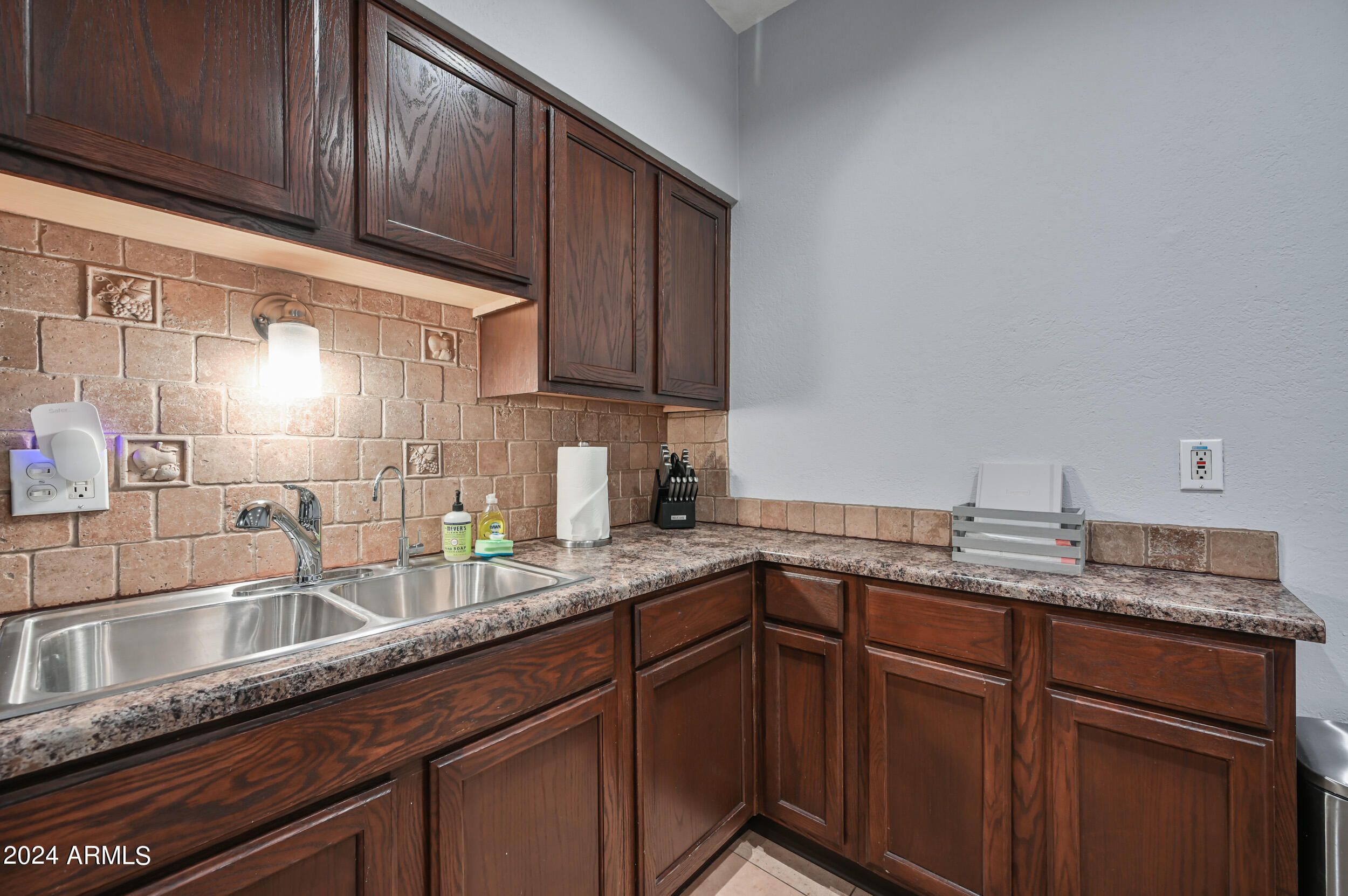 357 East Thomas Road, Unit A208 Phoenix, AZ 85012 - Photo 13 of 36 a kitchen with granite countertop stainless steel appliances a sink and cabinets