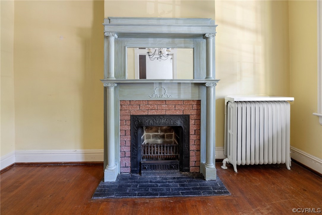 2018 Floyd Avenue Richmond, VA 23220 - Photo 11 of 36 a living room with a fireplace and a rug