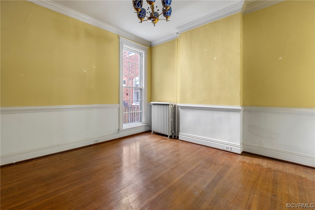 2018 Floyd Avenue Richmond, VA 23220 - Photo 13 of 36 wooden floor in an empty room with a window