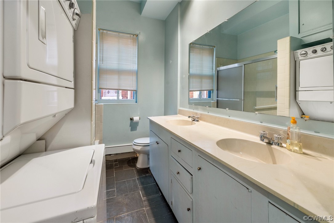 2018 Floyd Avenue Richmond, VA 23220 - Photo 17 of 36 a spacious bathroom with a granite countertop sink and a large mirror