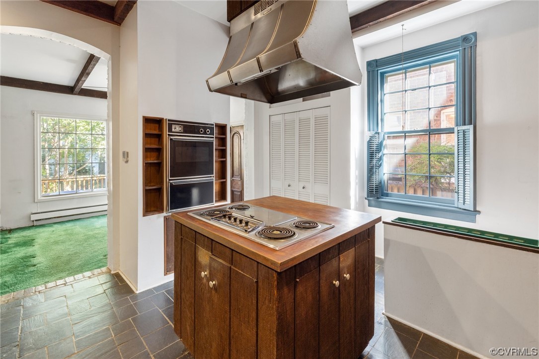 2018 Floyd Avenue Richmond, VA 23220 - Photo 18 of 36 a utility room with stainless steel appliances wooden floor and large window