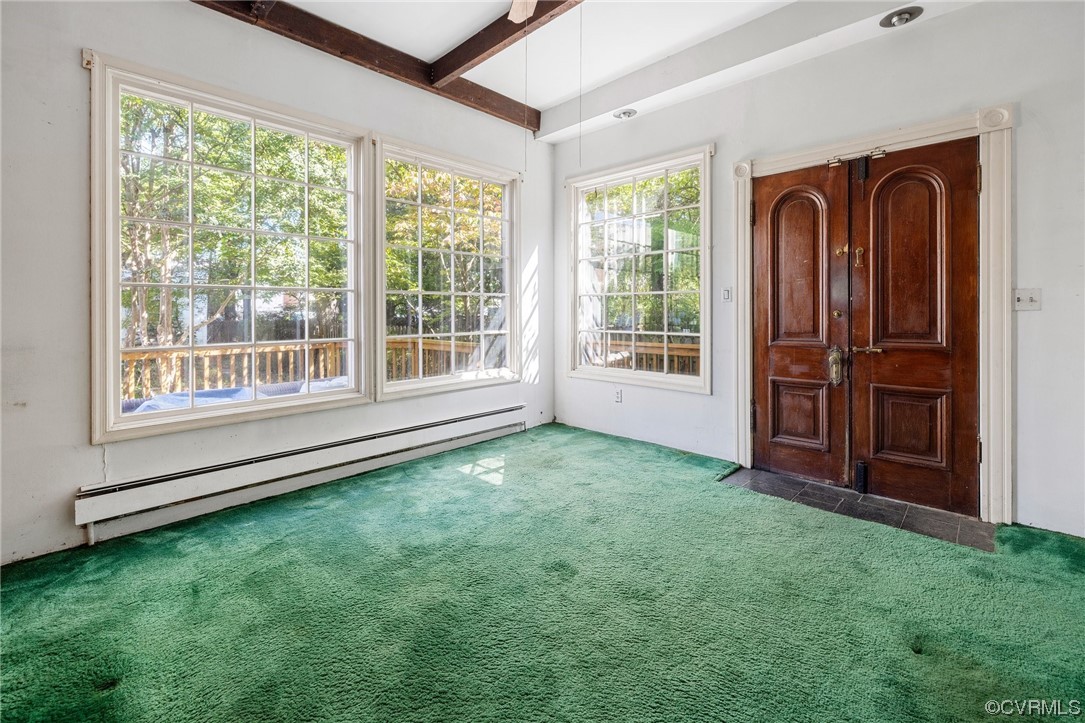 2018 Floyd Avenue Richmond, VA 23220 - Photo 21 of 36 an empty room with windows wooden floor and windows
