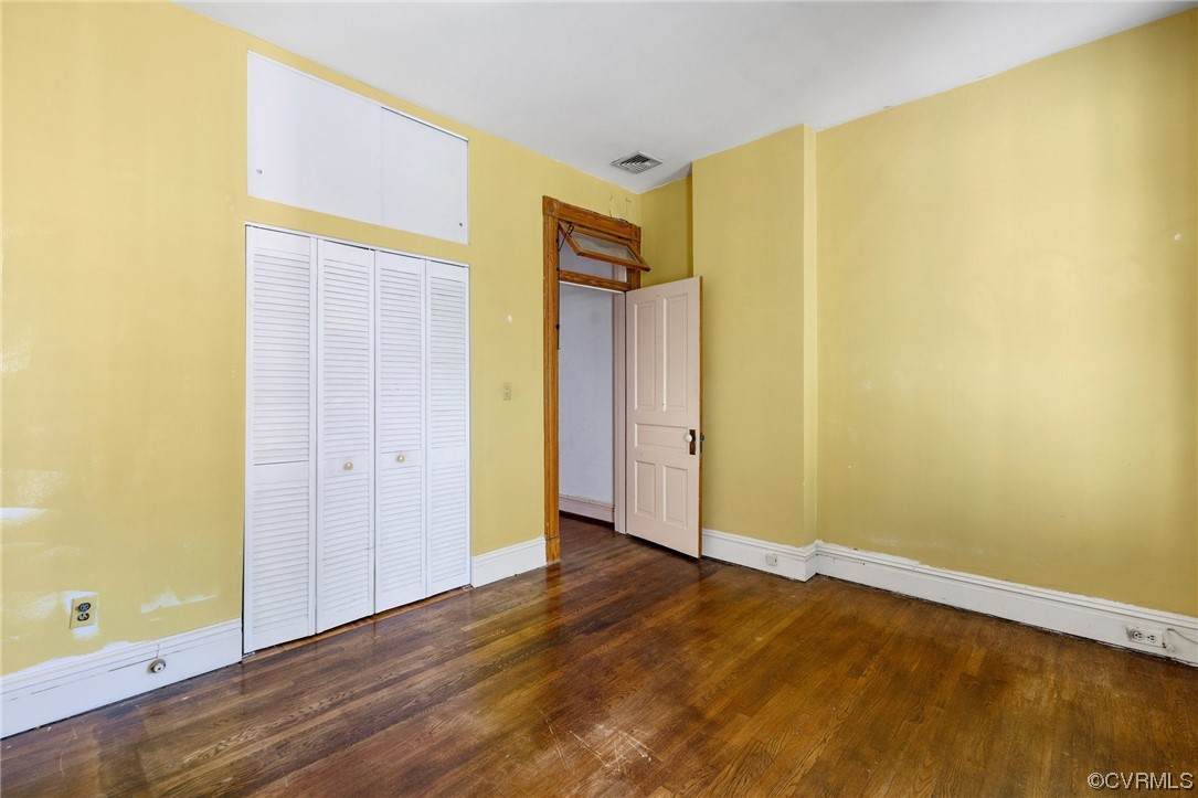 2018 Floyd Avenue Richmond, VA 23220 - Photo 29 of 36 a view of an empty room with wooden floor and a window