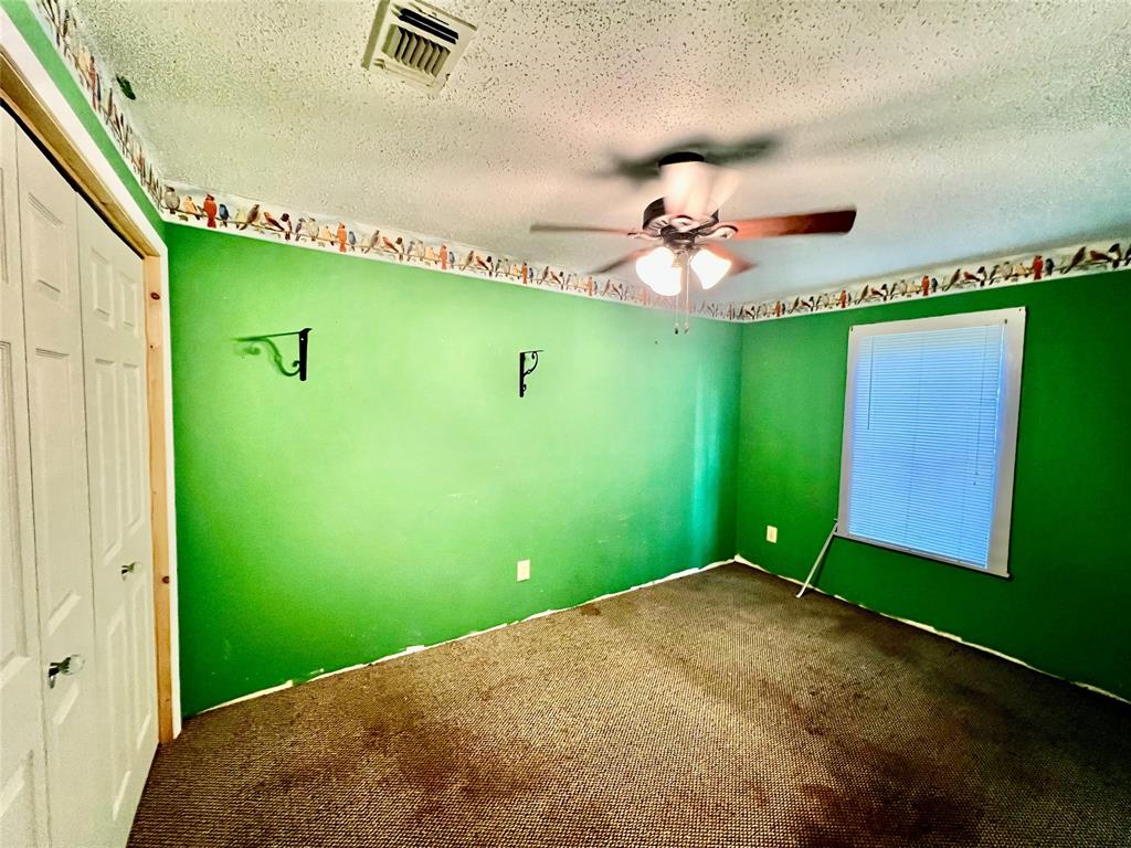 859 Farm To Market Road 2021 Lufkin, TX 75901 - Photo 11 of 20 a view of a big room with potted plants to a ceiling window