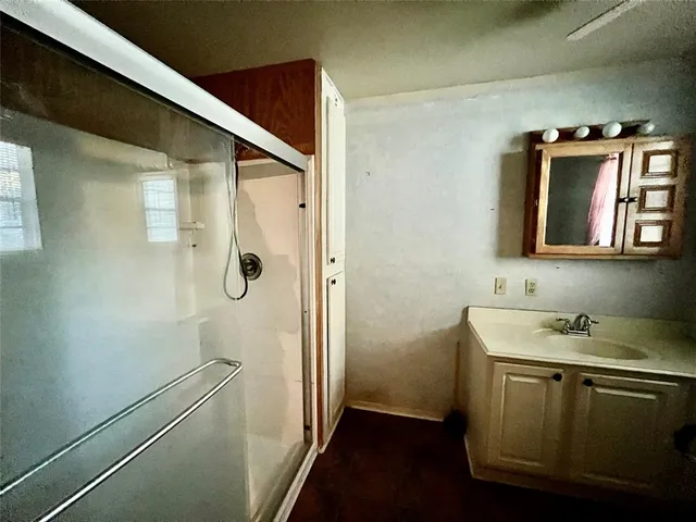a bathroom with a sink and mirror