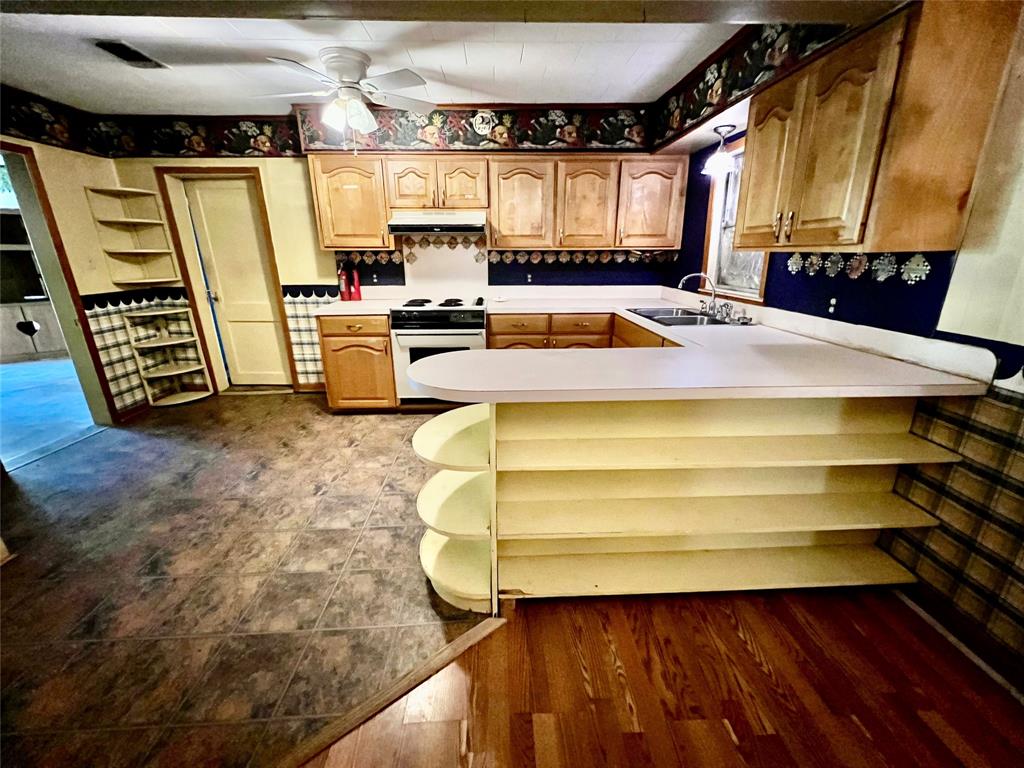859 Farm To Market Road 2021 Lufkin, TX 75901 - Photo 5 of 20 a view of a kitchen with refrigerator and window