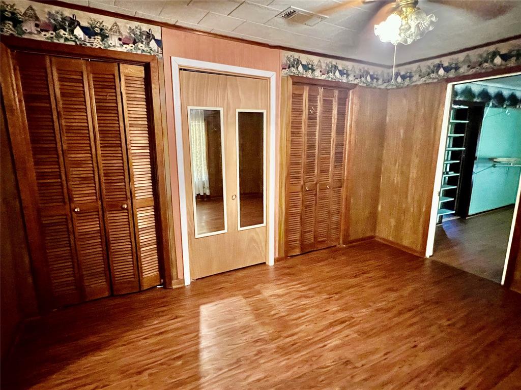 859 Farm To Market Road 2021 Lufkin, TX 75901 - Photo 9 of 20 a view of a room with wooden floor and stairs