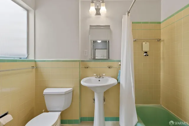 a bathroom with a sink and a toilet
