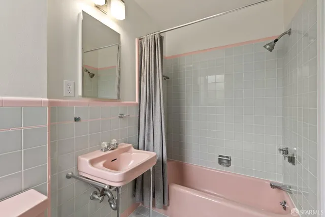a bathroom with a bath tub and a shower