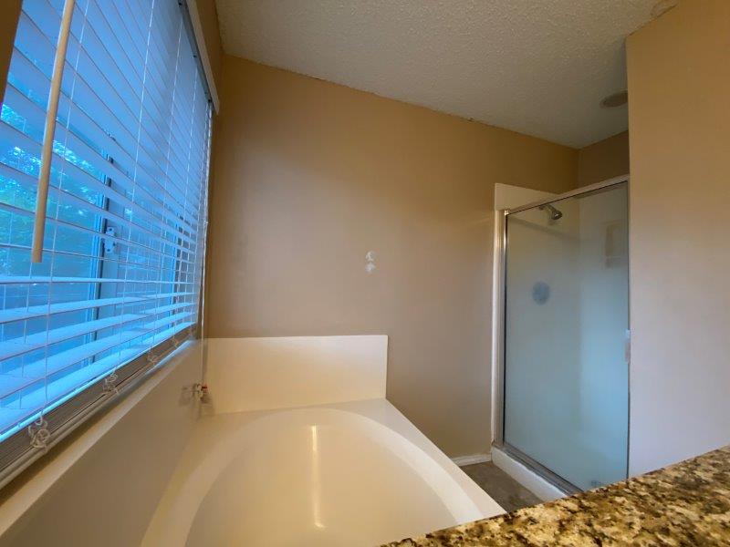 1903 Balsam Way Round Rock, TX 78665 - Photo 11 of 21 Relaxing soaking tub and separate shower create a serene bathing experience.