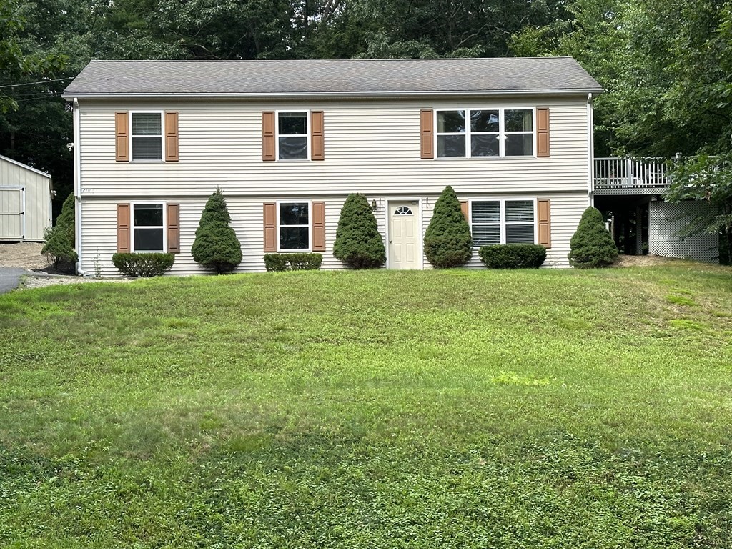210 Pine Hill Road Russell, MA 01071 - Photo 1 of 29 a front view of a house with a garden
