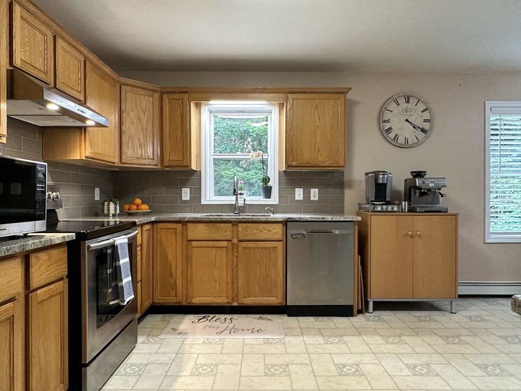 210 Pine Hill Road Russell, MA 01071 - Photo 13 of 29 a kitchen with stainless steel appliances granite countertop a stove a sink dishwasher and a refrigerator