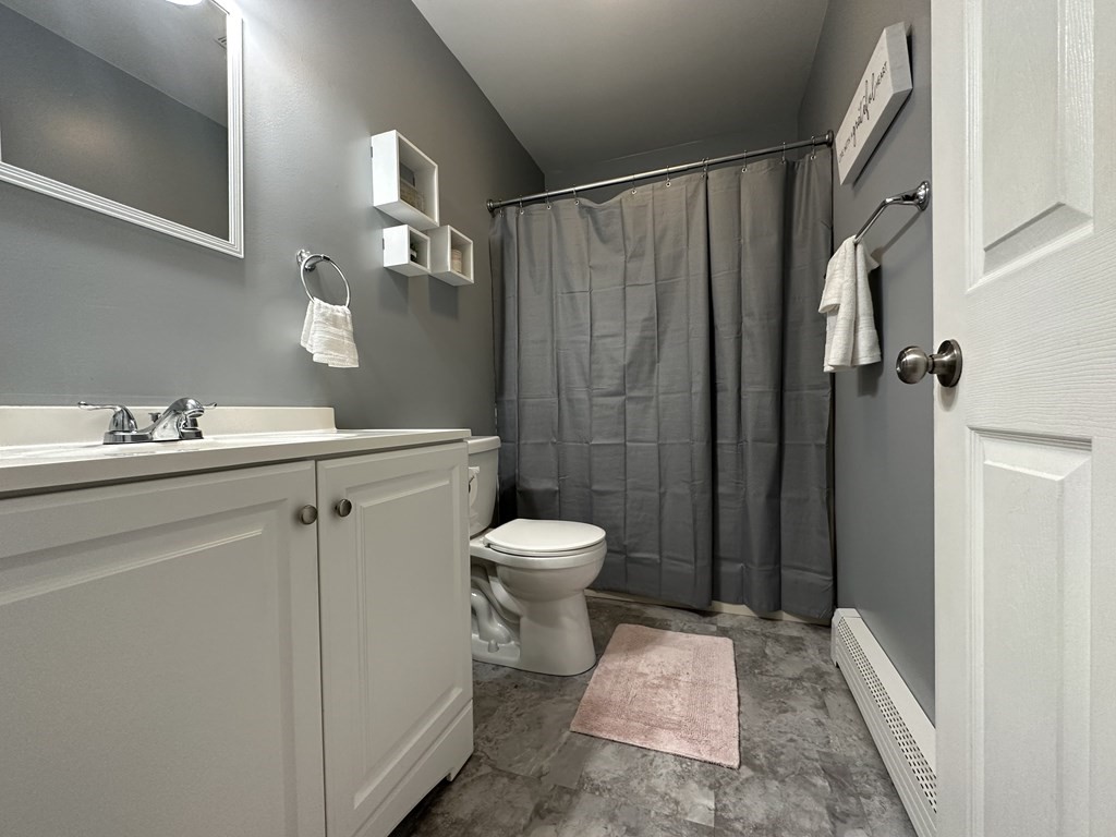 210 Pine Hill Road Russell, MA 01071 - Photo 14 of 29 a bathroom with a granite countertop sink toilet and shower