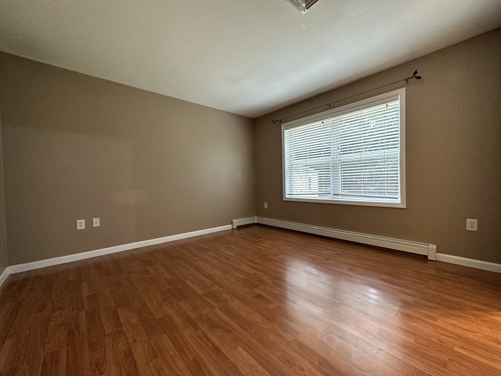 210 Pine Hill Road Russell, MA 01071 - Photo 15 of 29 a view of an empty room with wooden floor and a window