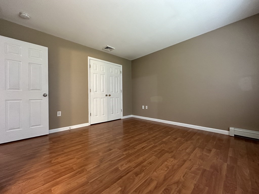 210 Pine Hill Road Russell, MA 01071 - Photo 16 of 29 a view of an empty room with wooden floor