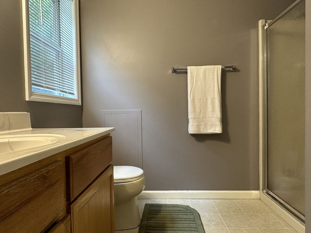 210 Pine Hill Road Russell, MA 01071 - Photo 17 of 29 a bathroom with a granite countertop sink toilet and shower