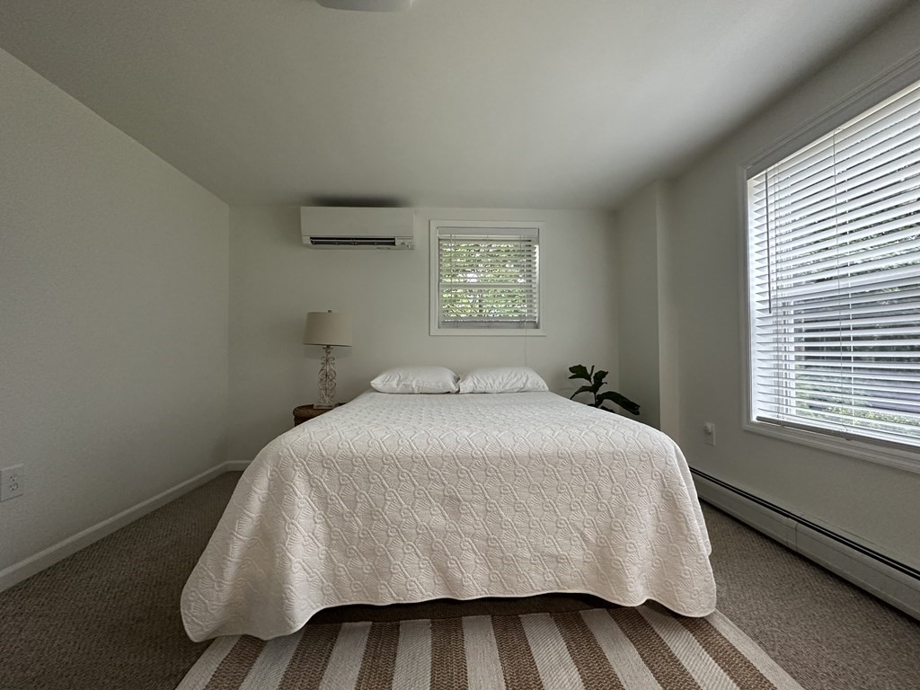 210 Pine Hill Road Russell, MA 01071 - Photo 22 of 29 a bedroom with a bed and window