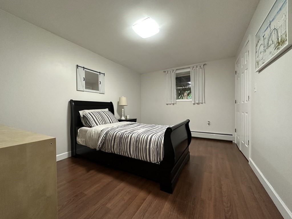 210 Pine Hill Road Russell, MA 01071 - Photo 23 of 29 a bedroom with a bed and a night stand