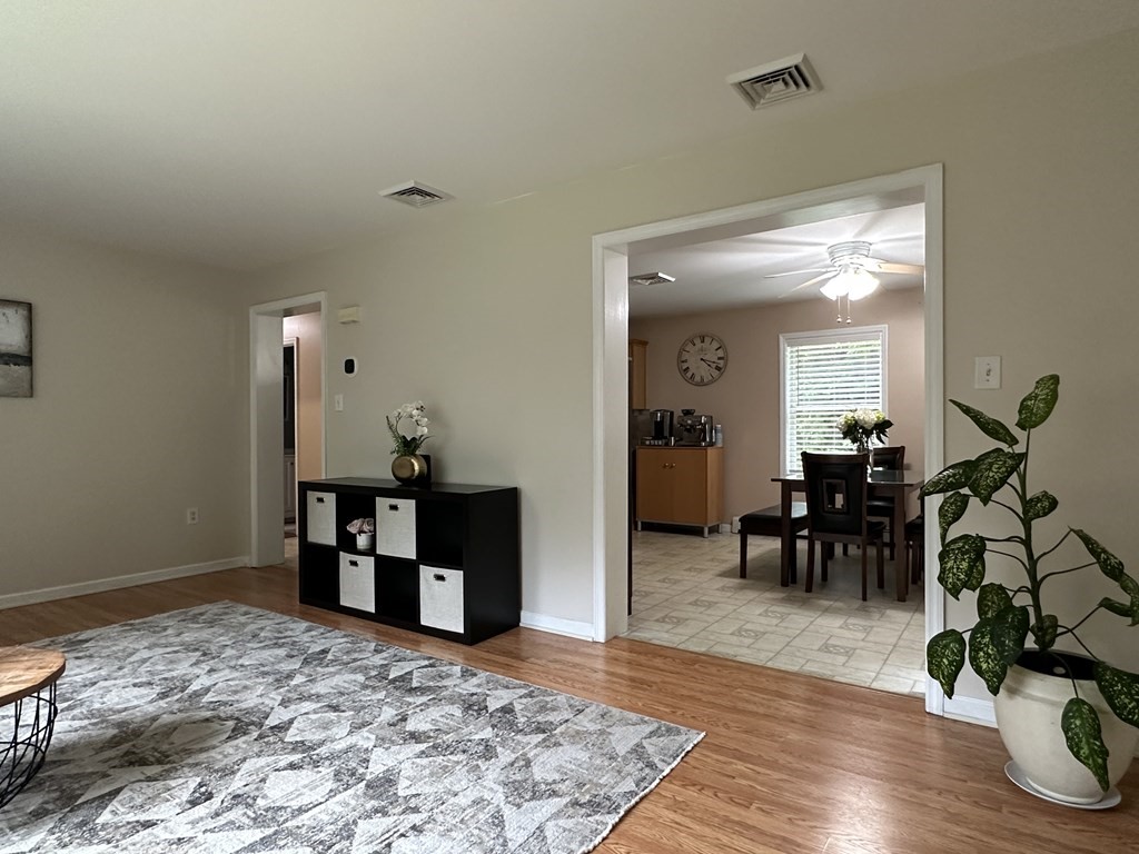 210 Pine Hill Road Russell, MA 01071 - Photo 9 of 29 a bedroom with furniture and a wooden floor