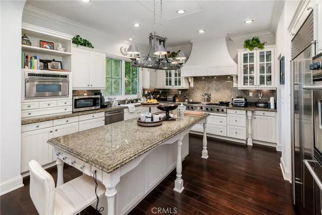 a living room with furniture flat screen tv and a fireplace