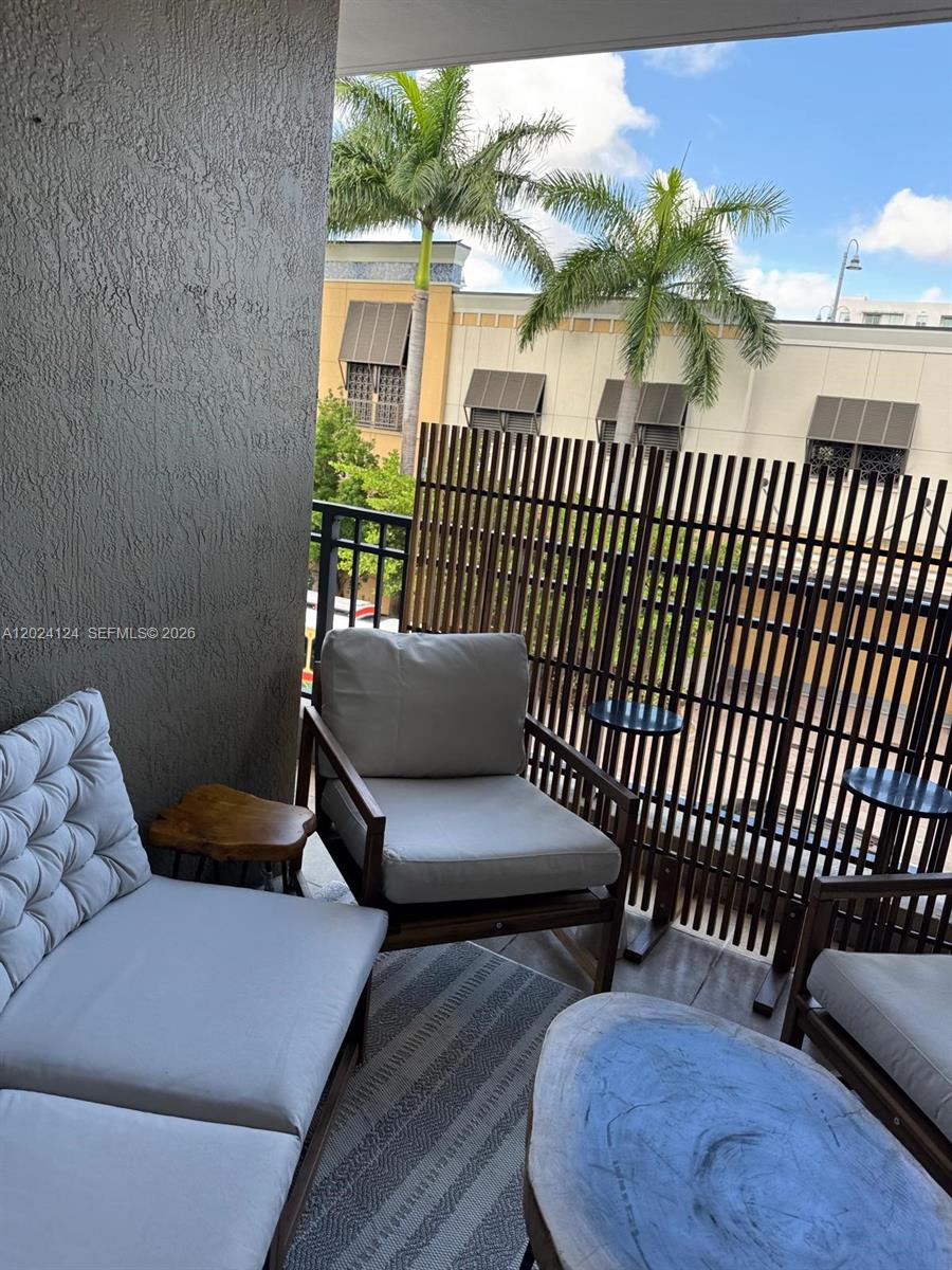 120 South Douglas Road, Unit 302 Miami, FL 33134 - Photo 21 of 28 a view of a porch with furniture