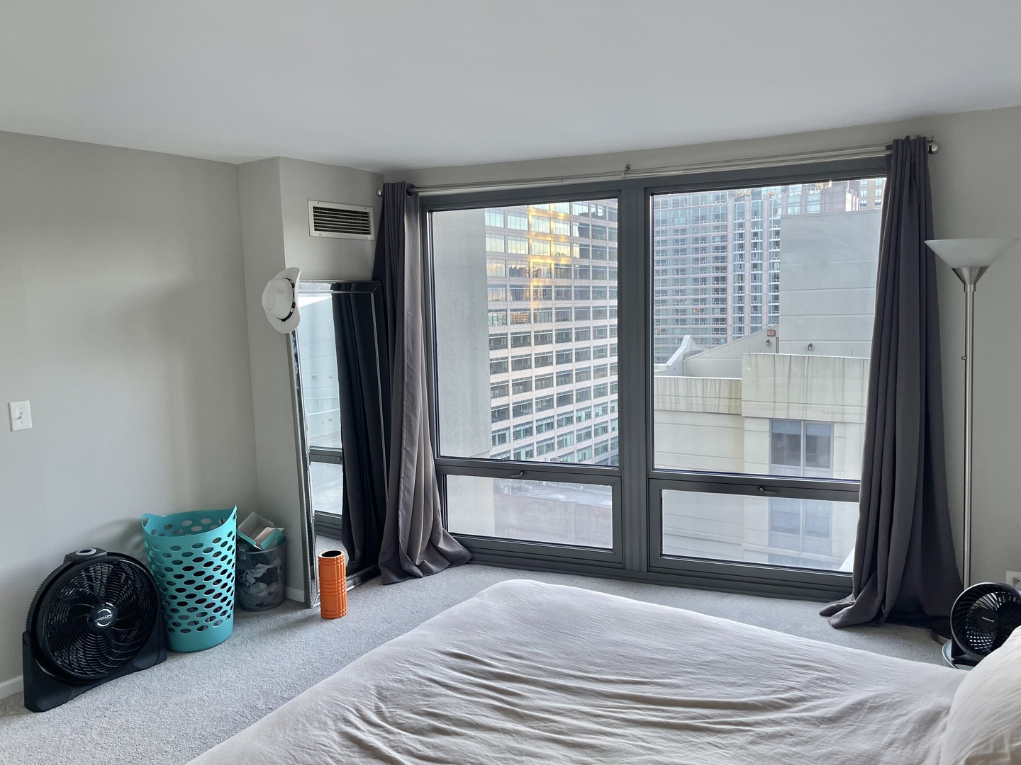 440 North Wabash Avenue, Unit 1903 Chicago, IL 60611 - Photo 16 of 34 a bedroom with a bed and wooden floor