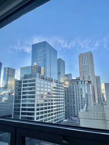 a bathroom with a bathtub and next to a window