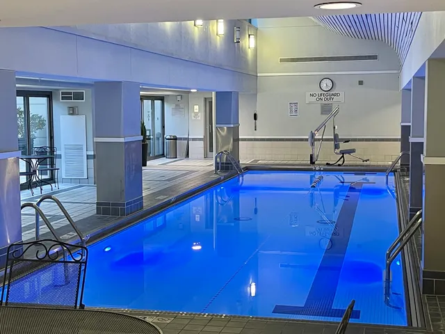 a view of a room with wooden floor and window