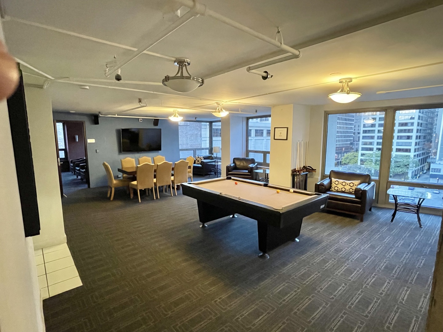 440 North Wabash Avenue, Unit 1903 Chicago, IL 60611 - Photo 30 of 34 a living room with furniture a table and kitchen view