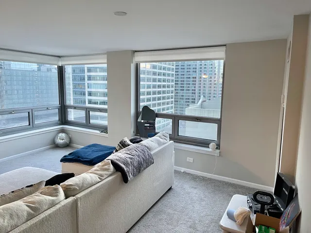 a living room with furniture and a window