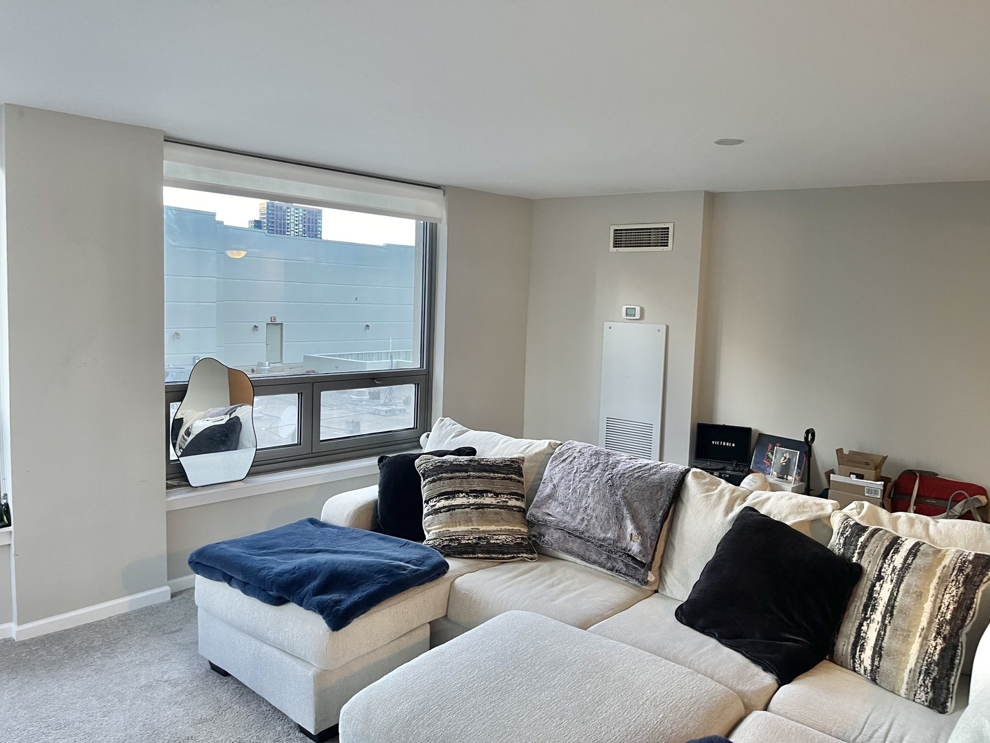 440 North Wabash Avenue, Unit 1903 Chicago, IL 60611 - Photo 7 of 34 a living room with furniture and a mirror