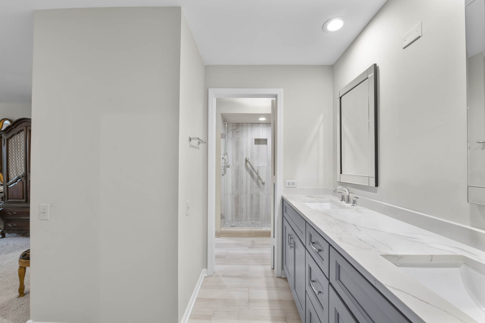 1771 Mission Hills Road, Unit 412 Northbrook, IL 60062 - Photo 12 of 21 a bathroom with a double vanity sink and a mirror