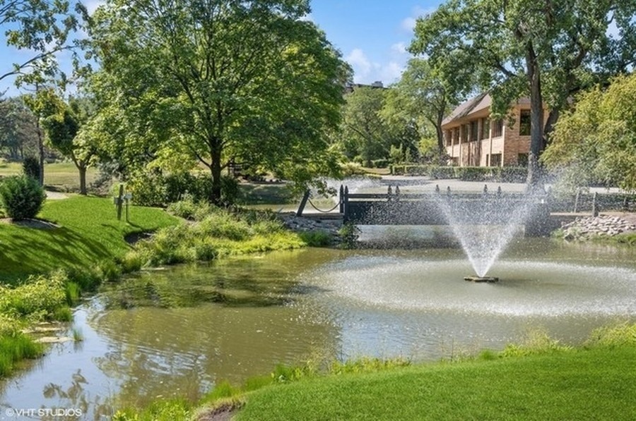 1771 Mission Hills Road, Unit 412 Northbrook, IL 60062 - Photo 20 of 21 a view of swimming pool with a yard