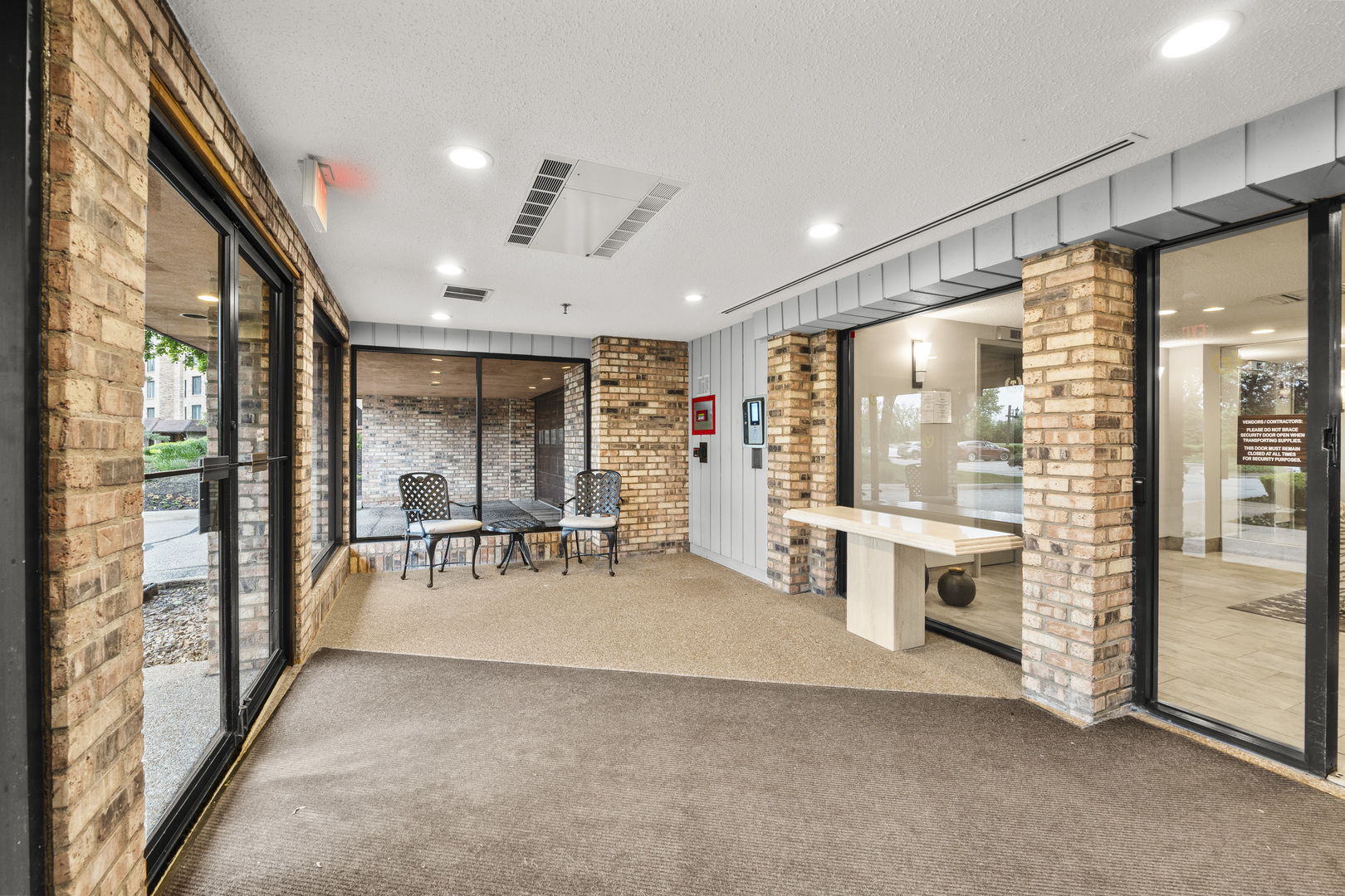 1771 Mission Hills Road, Unit 412 Northbrook, IL 60062 - Photo 2 of 21 a view of a livingroom with furniture outdoor view and large windows