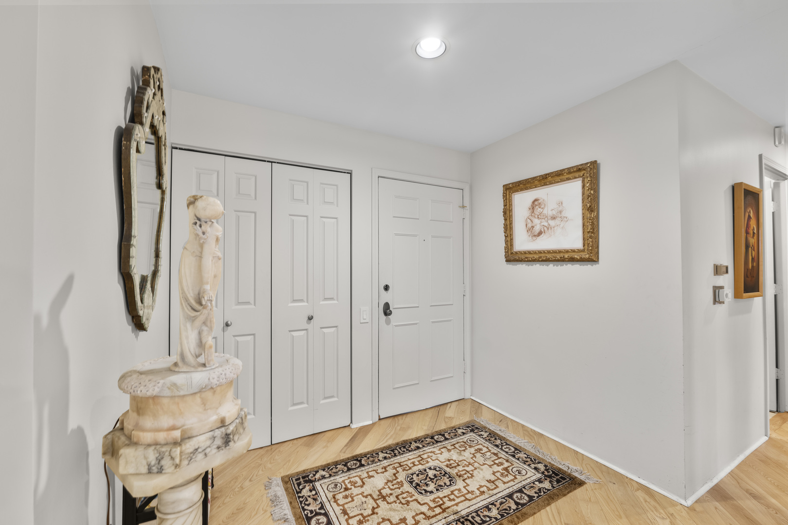 1771 Mission Hills Road, Unit 412 Northbrook, IL 60062 - Photo 4 of 21 a bathroom with a sink and a mirror